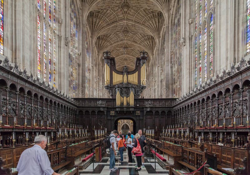 The pipe organ with two archangels playing trumpets and the chorus inside Kings College Chapel in Cambridge, England. The pipe organ with two archangels playing trumpets and the chorus inside Kings College Chapel in Cambridge, England