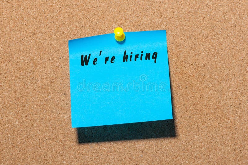 We Re Hiring Inscription on Peace of Paper Pinned To Notice Board with We Re Hiring Inscription on Peace of Paper Pinned To Notice Board with