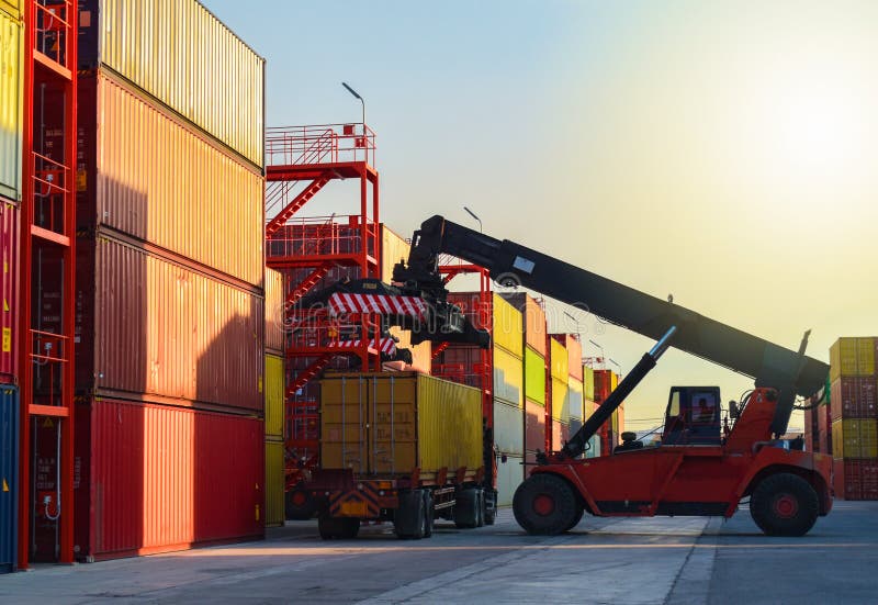 Reach stacker unload container from truck in container yards, Logistics operations.