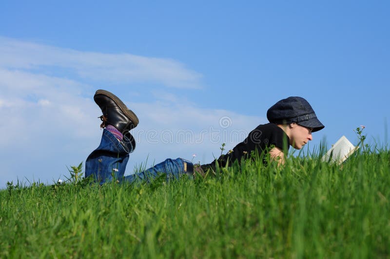 Girl reading a book outside in nature. Regenerate stock images, royalty-free photos and pictures