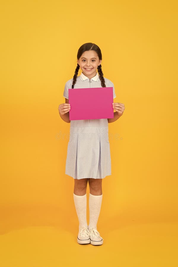 Read this. Upcoming event. Girl tidy dress hold poster. Schoolgirl hold poster copy space. News information. Changes royalty free stock photos Read this. Upcoming event. Girl tidy dress hold poster. Schoolgirl hold poster copy space. News information. Changes royalty free stock photos