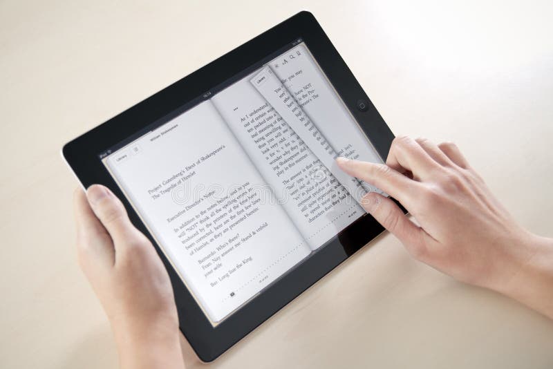Reading On Apple iPad2 royalty free stock images Reading On Apple iPad2 royalty free stock images