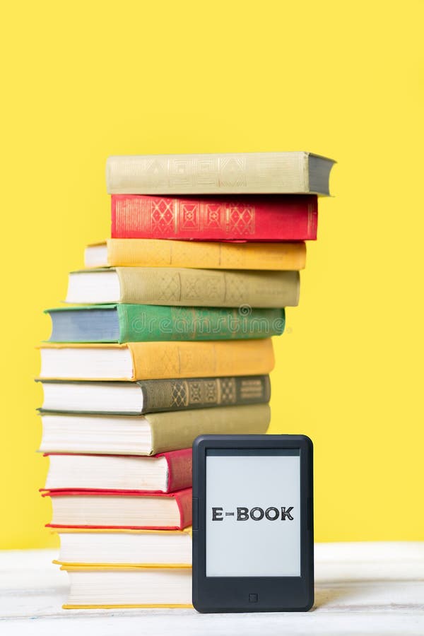 Reading. Ebook Reader And A Stack Of Books On A Yellow Background. Vertical. Copy Space