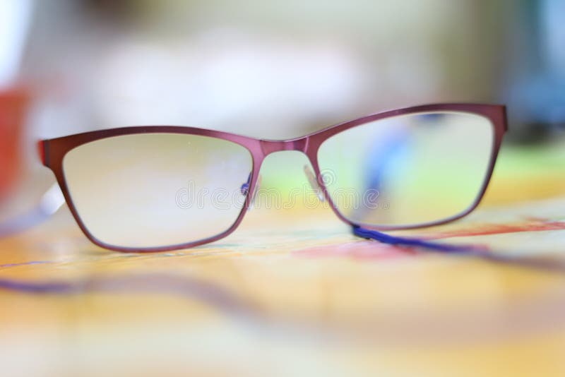 Reading glasses close up. Blurred background