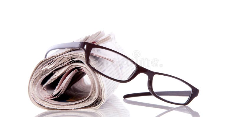 Reading glasses on newspaper