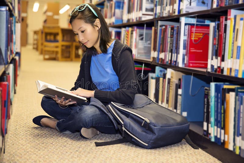 Reading in the Library stock photos