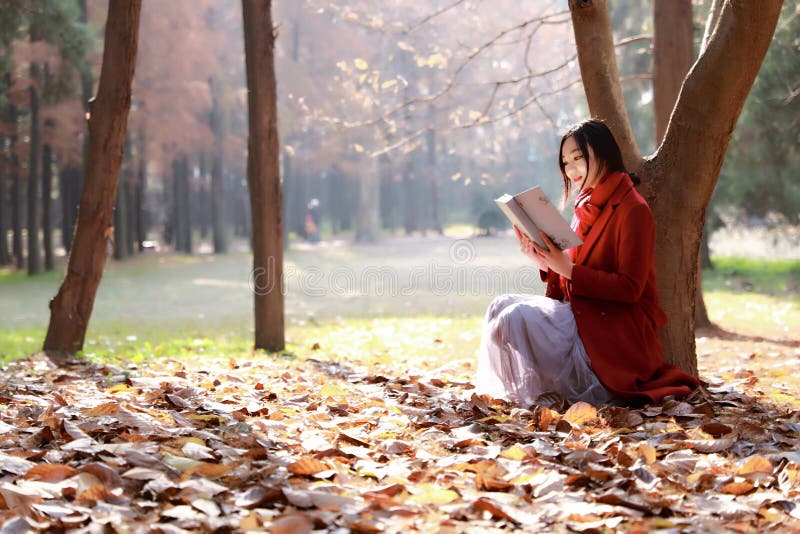 Reading in nature is my hobby,Girl reading book outdoors