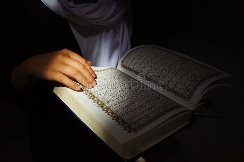 Reading the Quran stock image Reading the Quran stock image
