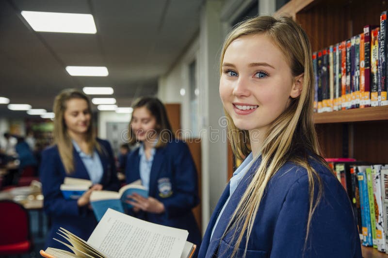 Reading In School Library stock photo Reading In School Library stock photo
