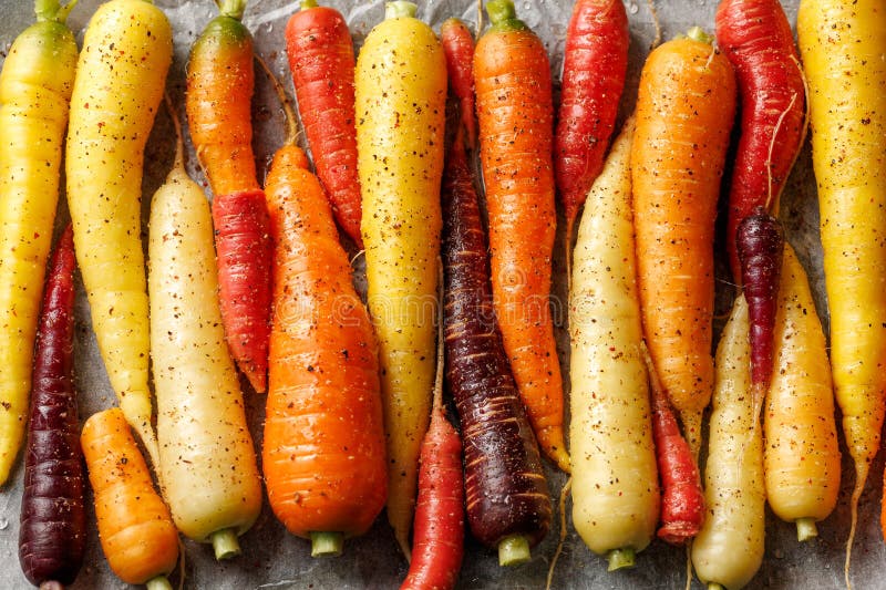 Ready To Bake Rainbow Carrots on a Parchment Lined Baking Sheet. Stock Image Image of rainbow