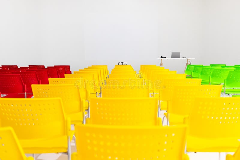 Ready to use rows of colorful chairs in conference room with pro royalty free stock photo Ready to use rows of colorful chairs in conference room with pro royalty free stock photo
