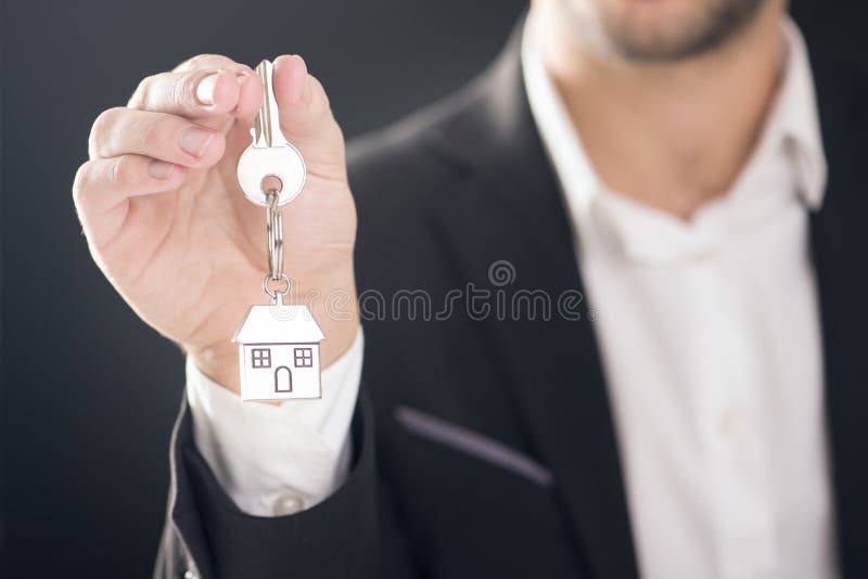 Real estate agent with house keys royalty free stock photography Real estate agent with house keys royalty free stock photography
