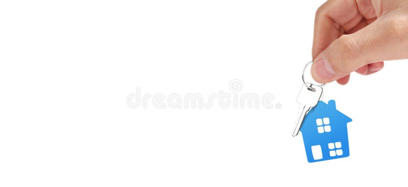 Real estate agent handing over house keys in hand