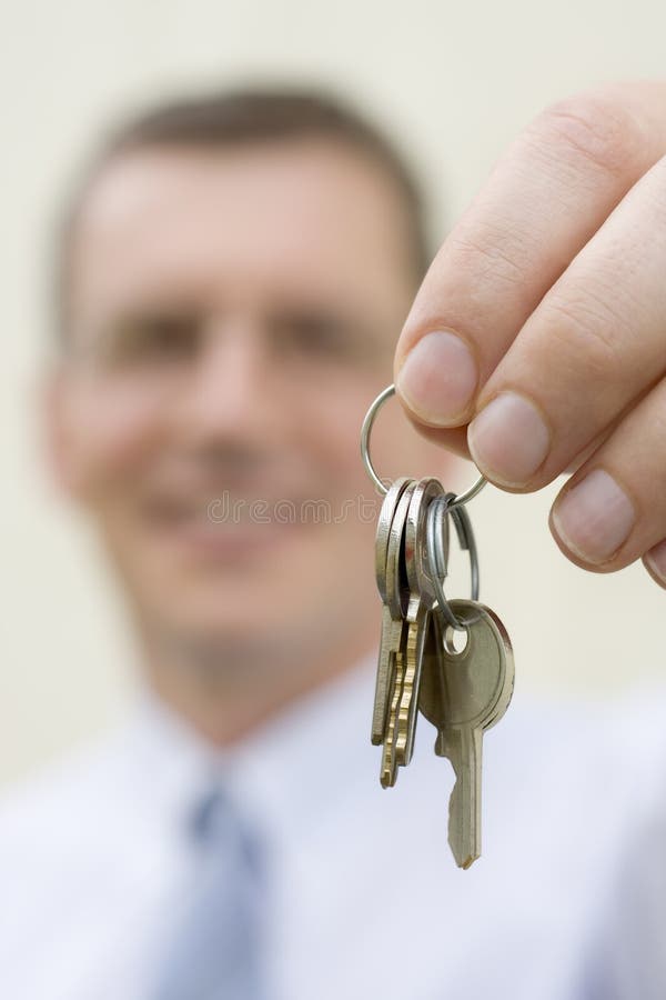 Real-estate agent handing over keys stock photos Real-estate agent handing over keys stock photos