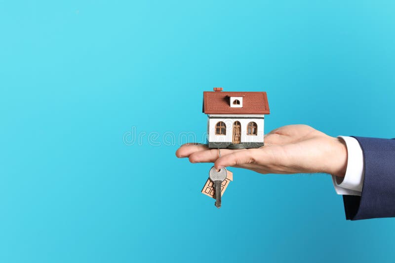 Real Estate Agent Holding House Model and Key Stock Photo - Image of market, concept: 124057468 Real Estate Agent Holding House Model and Key Stock Photo - Image of market, concept: 124057468