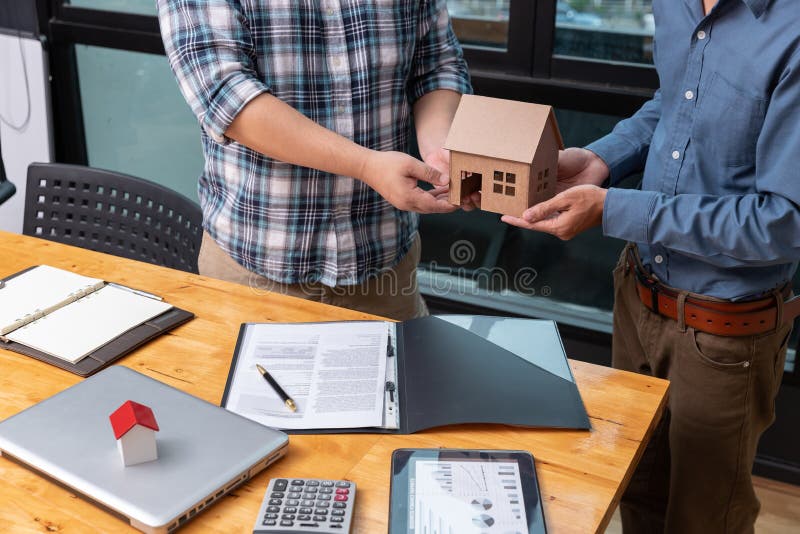 Real Estate Agent Showing His Client about Property Detail Stock Image