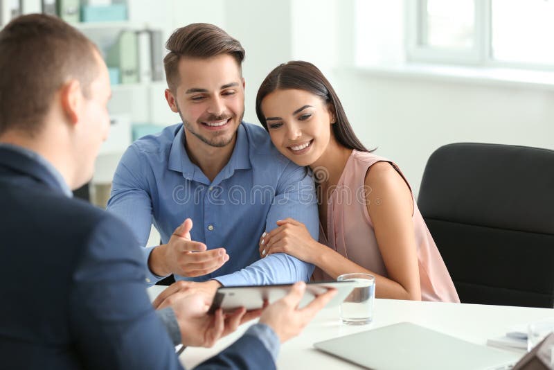 Real Estate Agent Working with Clients in Office Stock Image Image of
