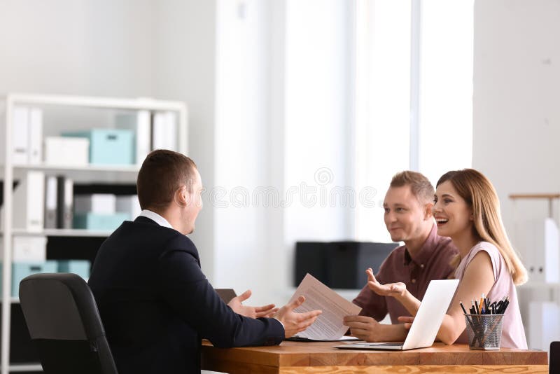 Real Estate Agent Working with Clients in Office Stock Image Image of