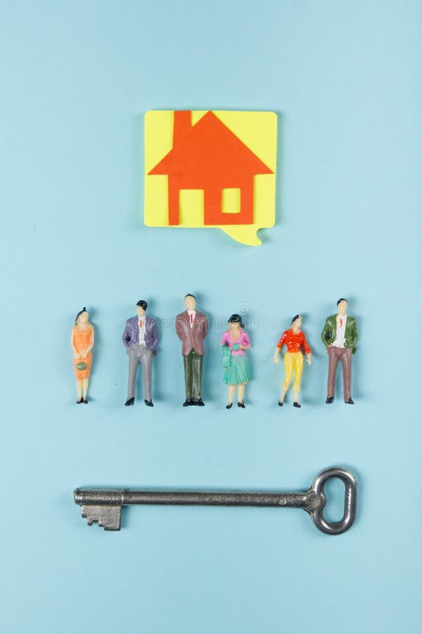 Real Estate concept. Construction building. Blank speech bubbles, people toy figures, paper model house, blueprints with royalty free stock photos Real Estate concept. Construction building. Blank speech bubbles, people toy figures, paper model house, blueprints with royalty free stock photos