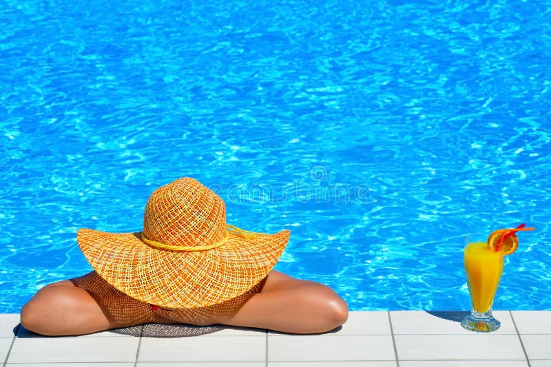 Real female beauty relaxing at swimming pool