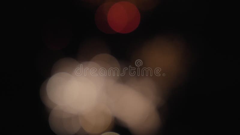 Real fireworks in a blurred bokeh abstract light up the night sky stock video