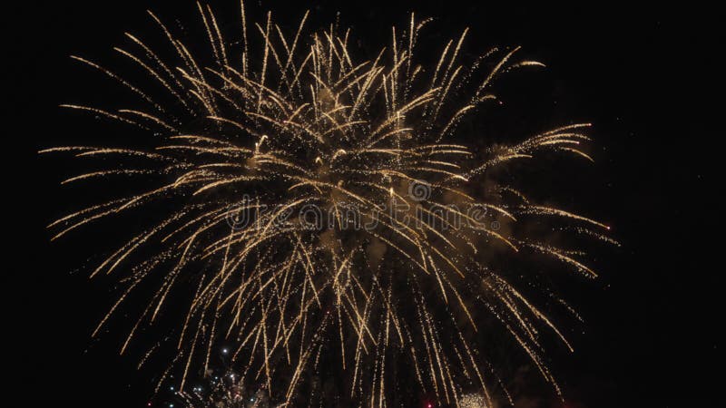 Real fireworks explode in the sky during a celebration. Slow motion stock video footage