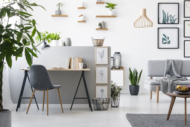 Real photo of a home office interior with a living room. Modern furniture and paintings on the wall royalty free stock image Real photo of a home office interior with a living room. Modern furniture and paintings on the wall royalty free stock image