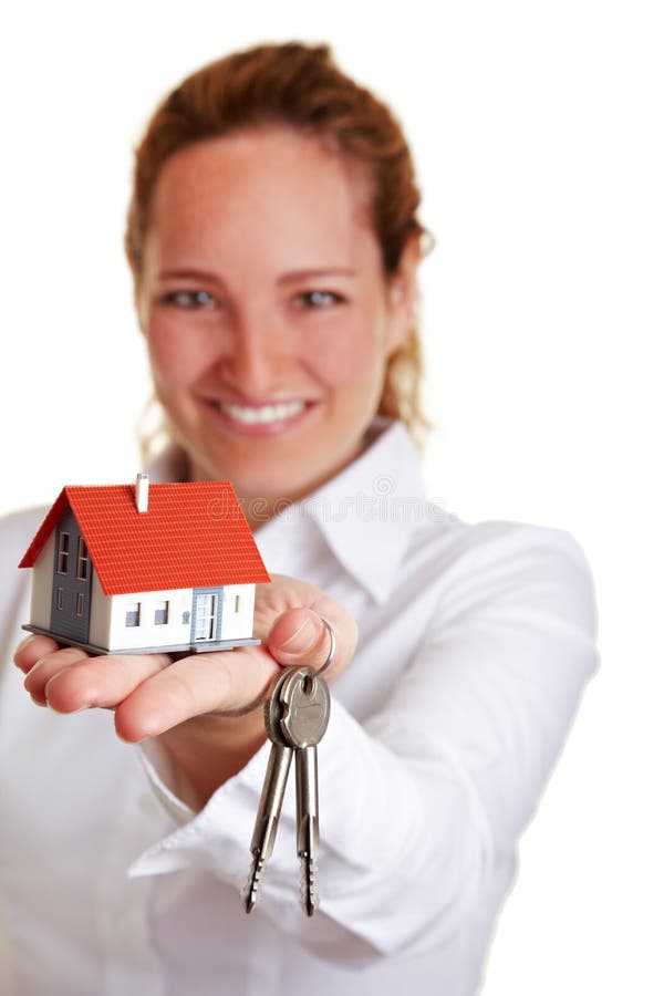 Realtor woman offering house keys