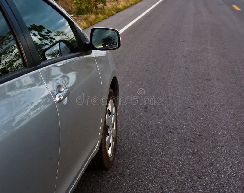 Rear Side Perspective View of Car on Road Countryside Stock Photo