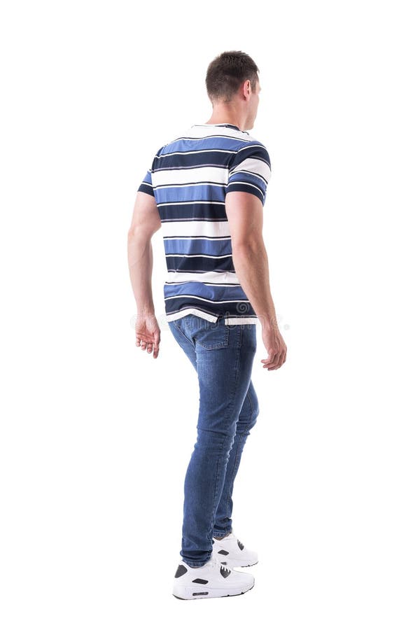 Rear side view of casual young adult man walking or leaving looking away