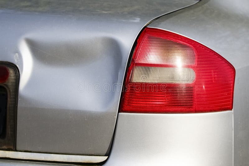 Rear of silver car get damaged by crash stock photos Rear of silver car get damaged by crash stock photos