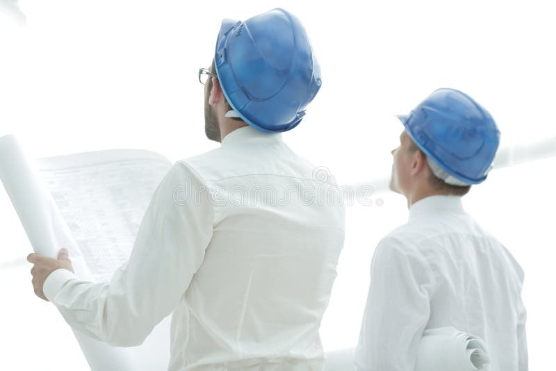 Rear view. architect and Builder looking at blank screen stock images