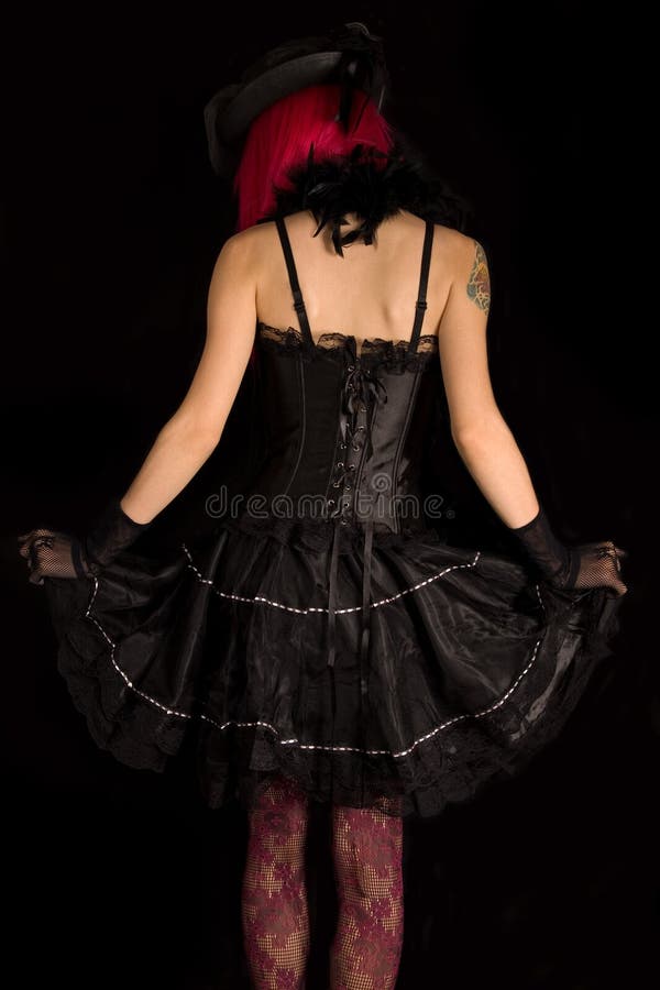 Rear view of cabaret girl in black corset dress