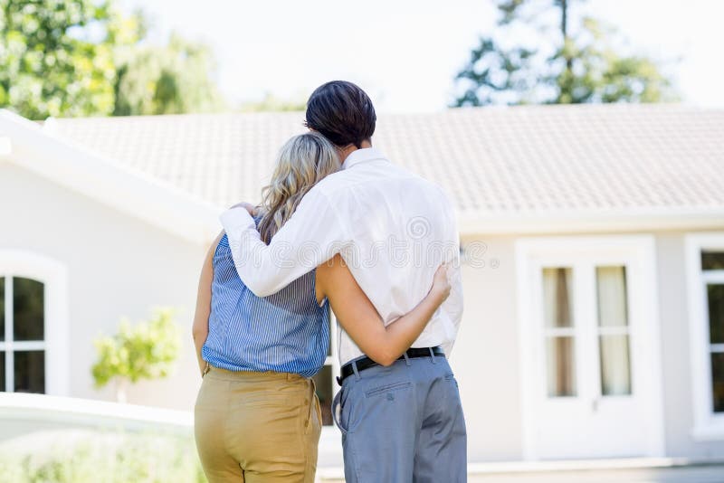 Rear view of a lesbian couple standing together stock photo