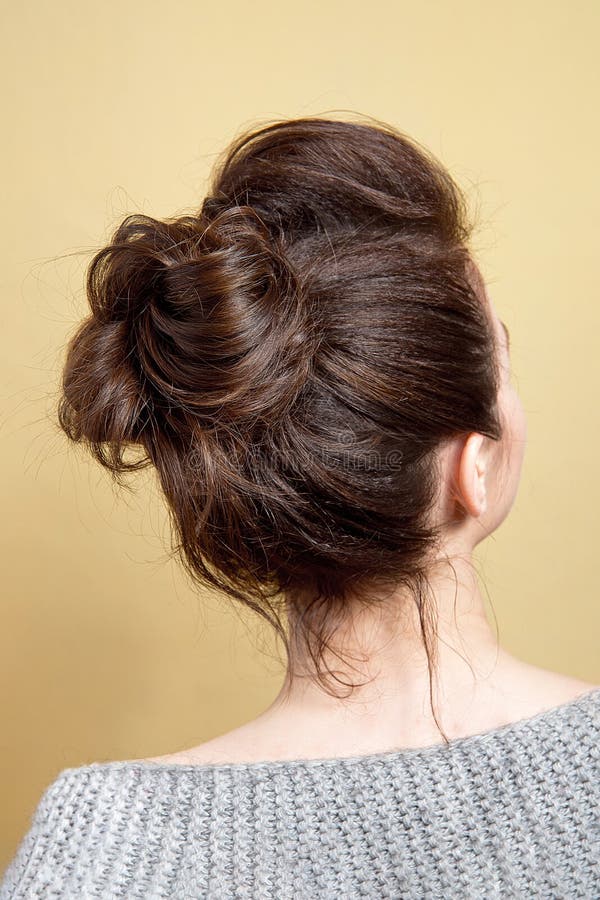 Rear View of Female Hairstyle Medium Bun on Long Straight Brown Hair with  Radical Volume. Stock Photo - Image of haircut, chignon: 152001062