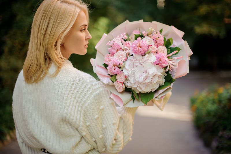 Rear View Girl Holding a Bouquet of Tender Pink Flowers Decorated with ...