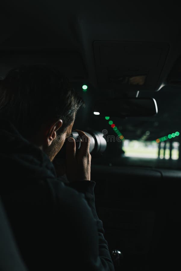 Rear View of Man Doing Surveillance by Camera with Object Glass from