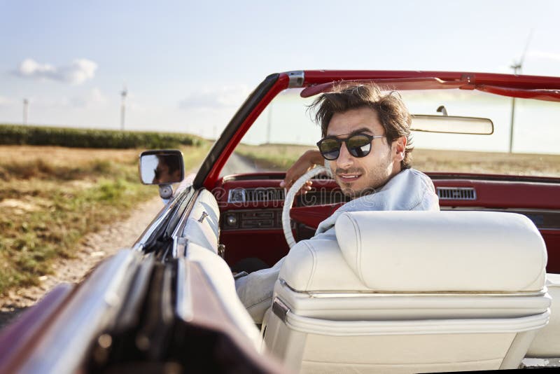 Rear View of Handsome Man in a Red Convertible Stock Photo - Image of ...