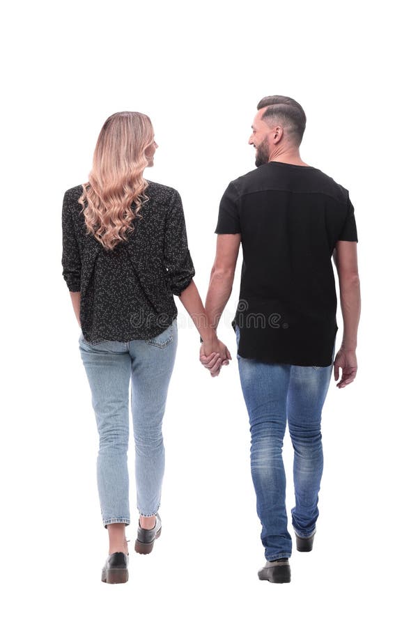 Rear view. modern young couple walking together stock photography