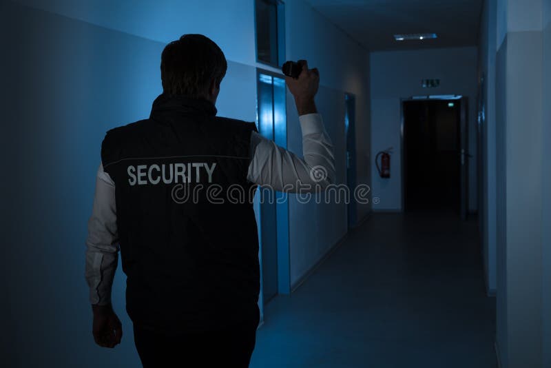 Security Guard Standing In Corridor Of The Building stock image Security Guard Standing In Corridor Of The Building stock image