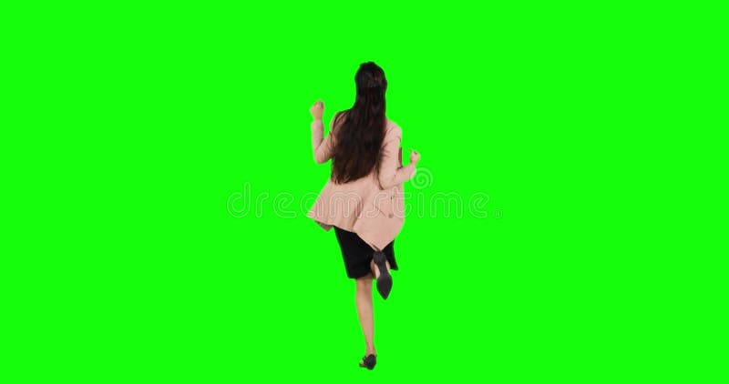Rear view of successful businesswoman dancing