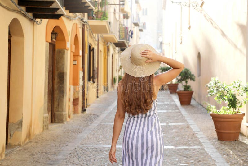 Premium Photo  Seductive sicilian woman sitting on a step in an old town  in sicily