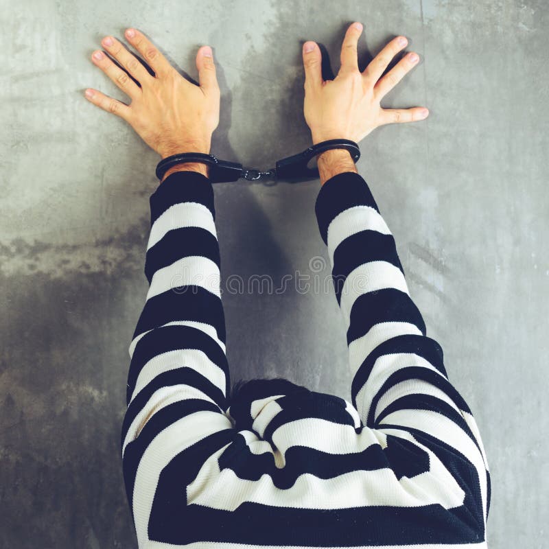 Rear view of unidentified prisoner in prison stripped uniform st stock photography Rear view of unidentified prisoner in prison stripped uniform st stock photography