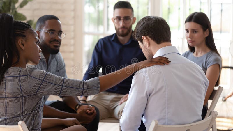 Rear view at upset man feel depression get psychological support