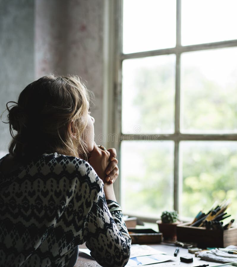 Rear view of woman sitting thoughtful lookout of the window stock photos Rear view of woman sitting thoughtful lookout of the window stock photos