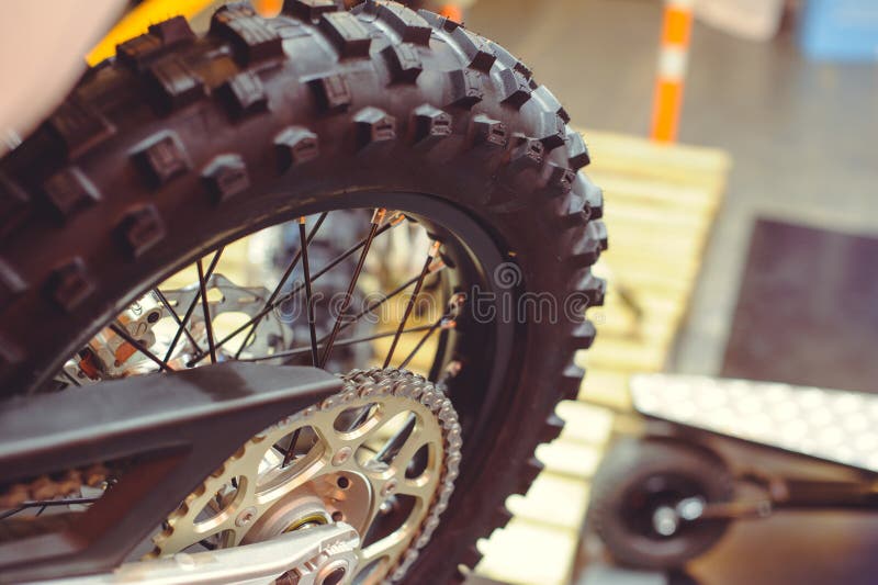 Rear wheel of motorcycle, studded tire and chain royalty free stock image Rear wheel of motorcycle, studded tire and chain royalty free stock image