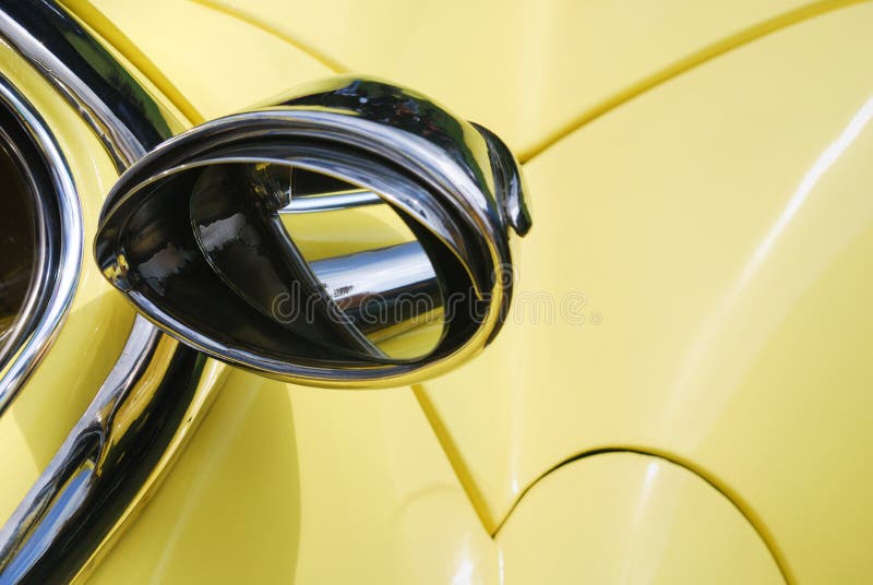 Rearview mirror on yellow car