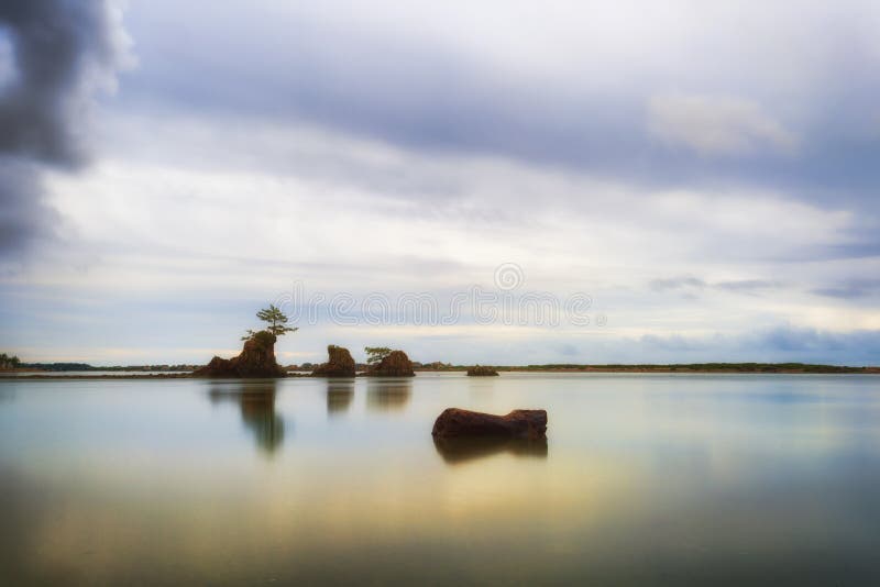 A receding storm leaves behind calm waters and deserted beach in the early evening hours at Siletz Bay in Lincoln City Oregon. A receding storm leaves behind calm waters and deserted beach in the early evening hours at Siletz Bay in Lincoln City Oregon