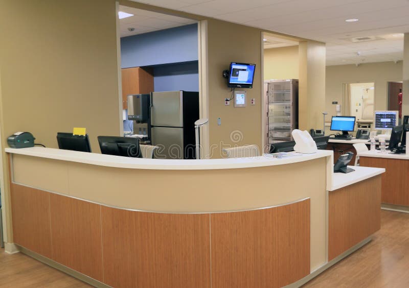 Front Reception Desk with computer terminals and phones in commercial office, hospital, school or hotel. Front Reception Desk with computer terminals and phones in commercial office, hospital, school or hotel.