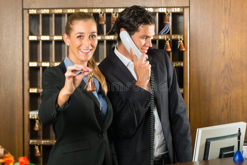 Reception in hotel - Man and woman royalty free stock photography